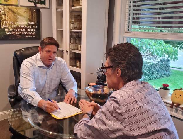 Dr. Robert White consulting with a patient at Advanced Integrated Health