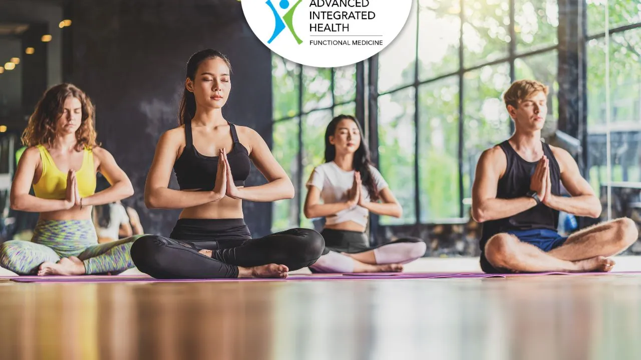 Group meditating in cross-legged pose, a cooling practice for how to reduce Pitta immediately