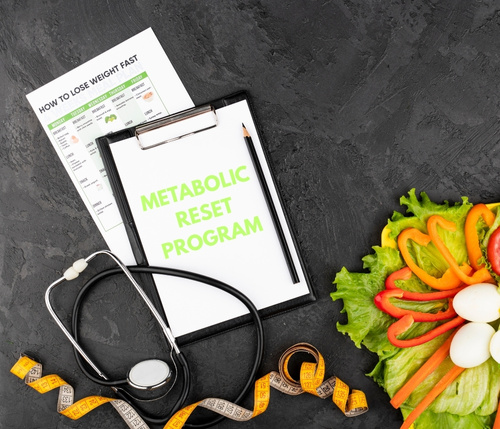Clipboard with blank notepad, stethoscope, measuring tape, and fresh vegetables and boiled eggs on a black background, representing healthy eating and weight loss planning